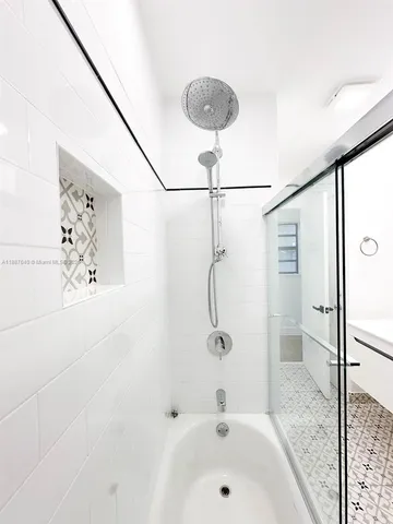 a bathroom with a toilet a sink and shower
