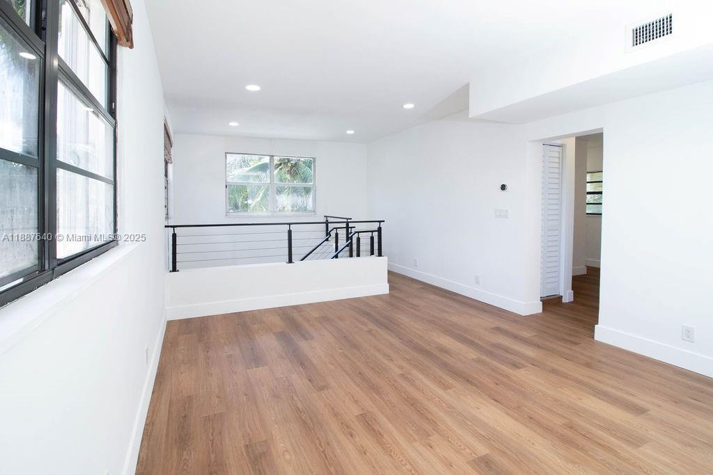 1255 Jackson Street Hollywood, FL 33019 - Photo 49 of 72 a view of room with window and wooden floor