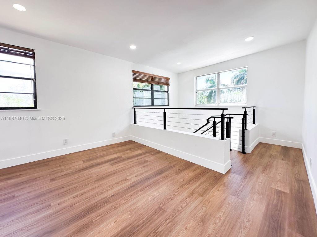 1255 Jackson Street Hollywood, FL 33019 - Photo 51 of 72 a view of a room with wooden floor and a window