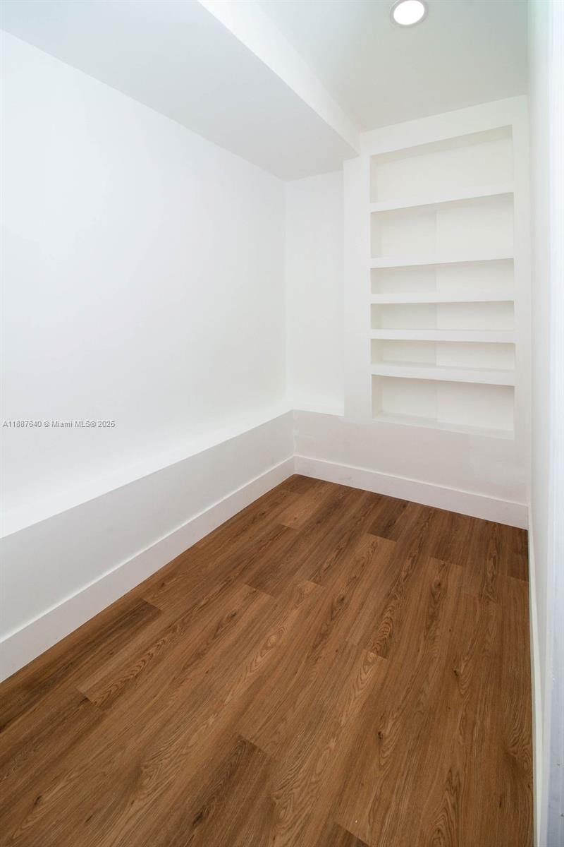 1255 Jackson Street Hollywood, FL 33019 - Photo 58 of 72 a view of a room with wooden floor and white walls