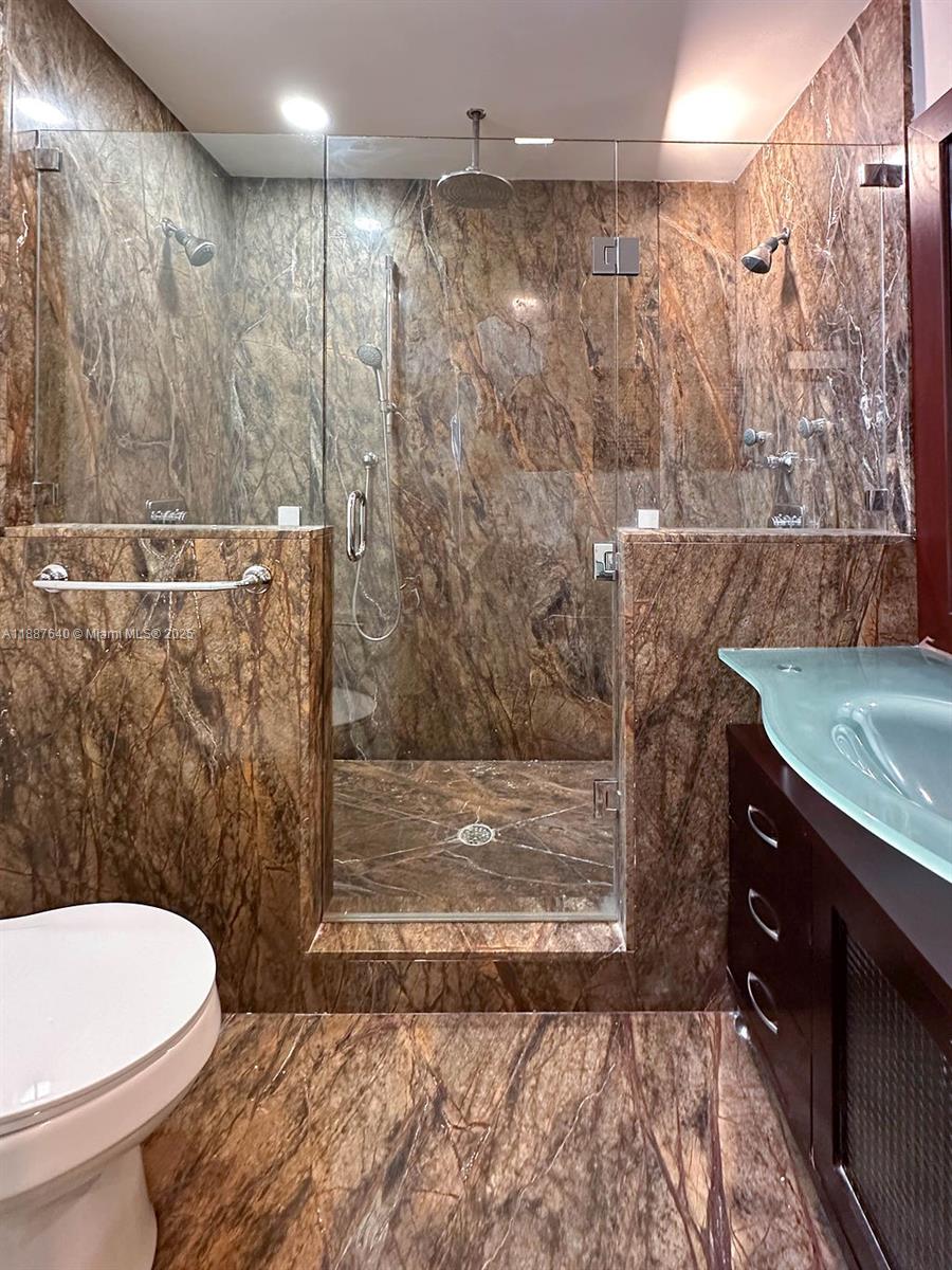 1255 Jackson Street Hollywood, FL 33019 - Photo 64 of 72 a bathroom with a toilet a sink and shower