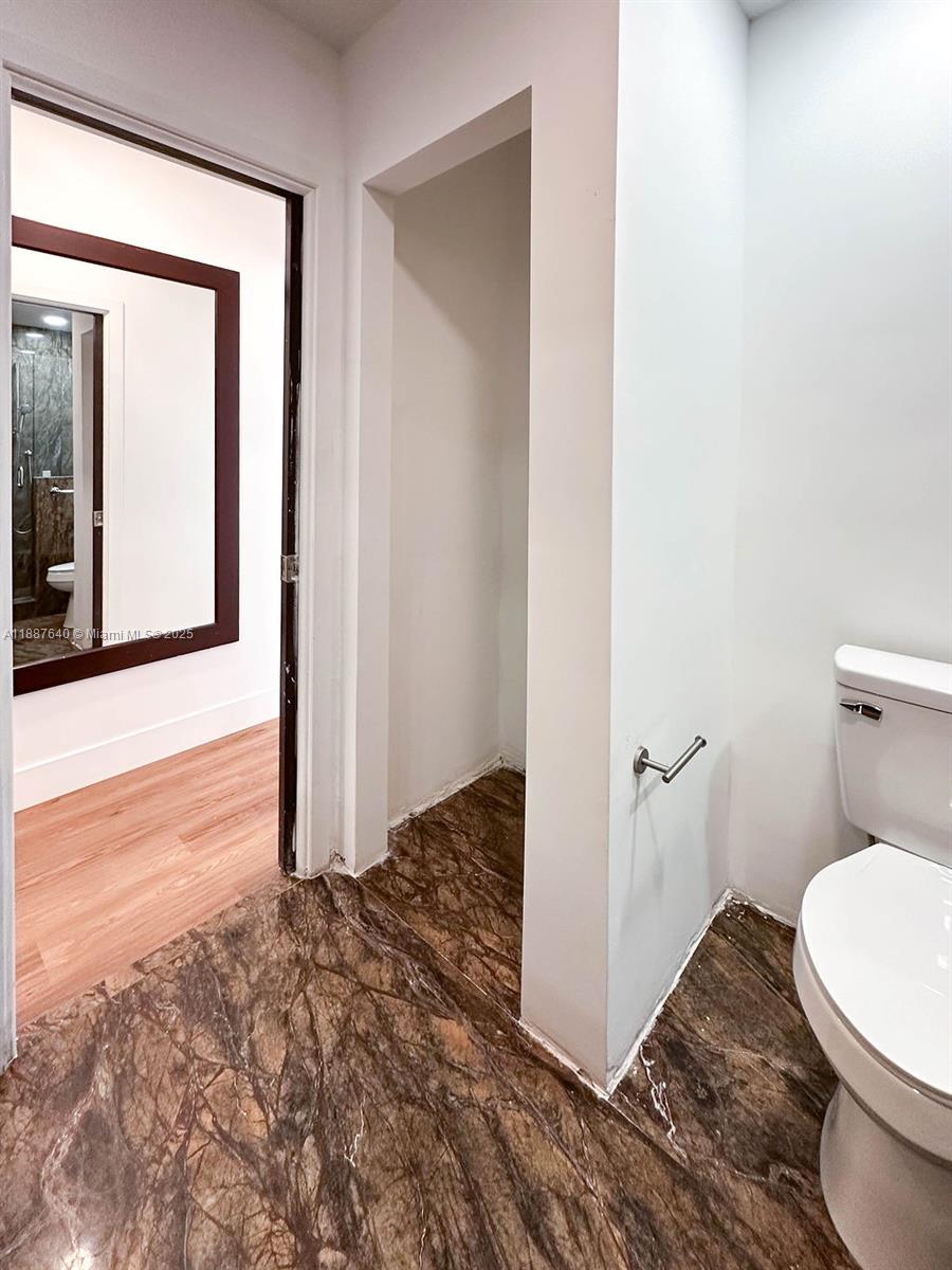 1255 Jackson Street Hollywood, FL 33019 - Photo 67 of 72 a bathroom with a toilet and a sink