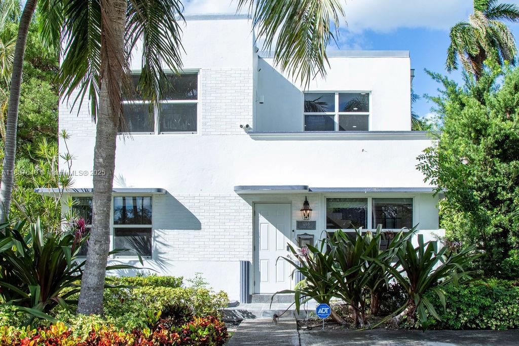 1255 Jackson Street Hollywood, FL 33019 - Photo 9 of 72 a front view of house with yard and green space