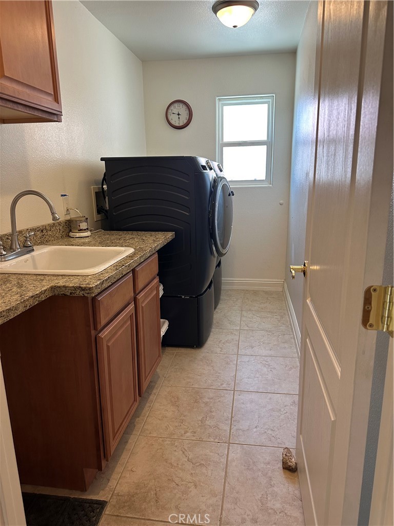 14108 Rivers Edge Road Helendale, CA 92342 - Photo 23 of 37 a kitchen with a refrigerator and a sink