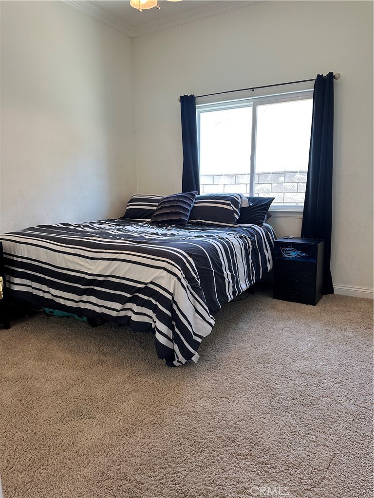 14108 Rivers Edge Road Helendale, CA 92342 - Photo 29 of 37 a bedroom with a bed and wooden floor