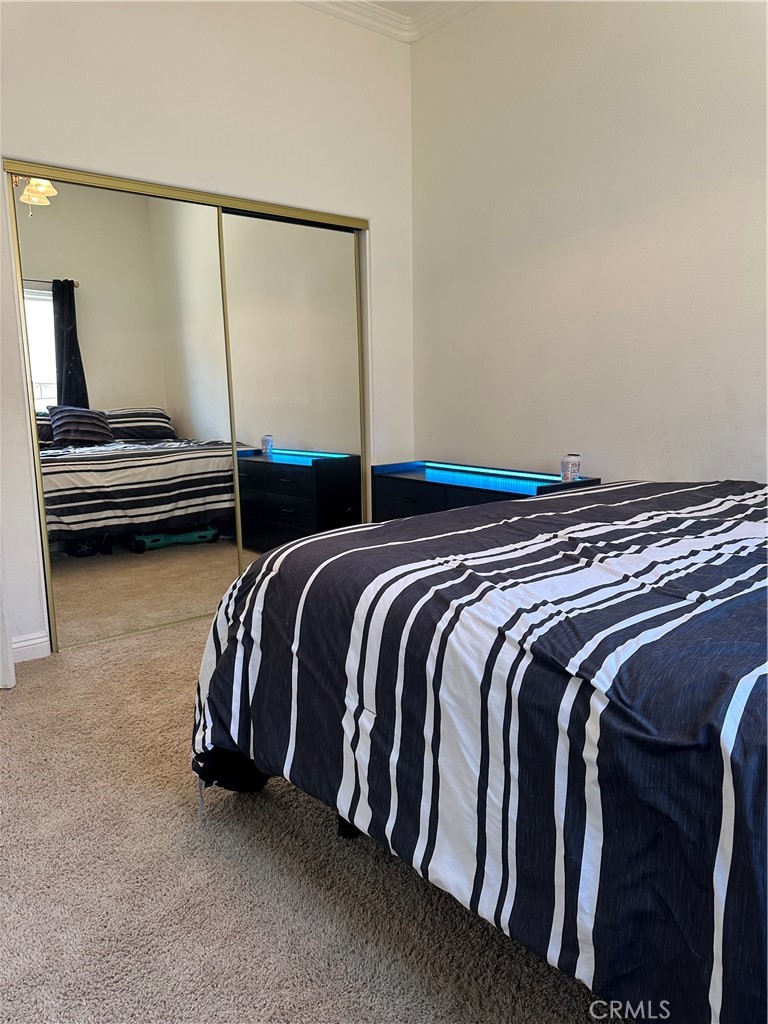 14108 Rivers Edge Road Helendale, CA 92342 - Photo 30 of 37 a view of walk in closet with clothes and shoes