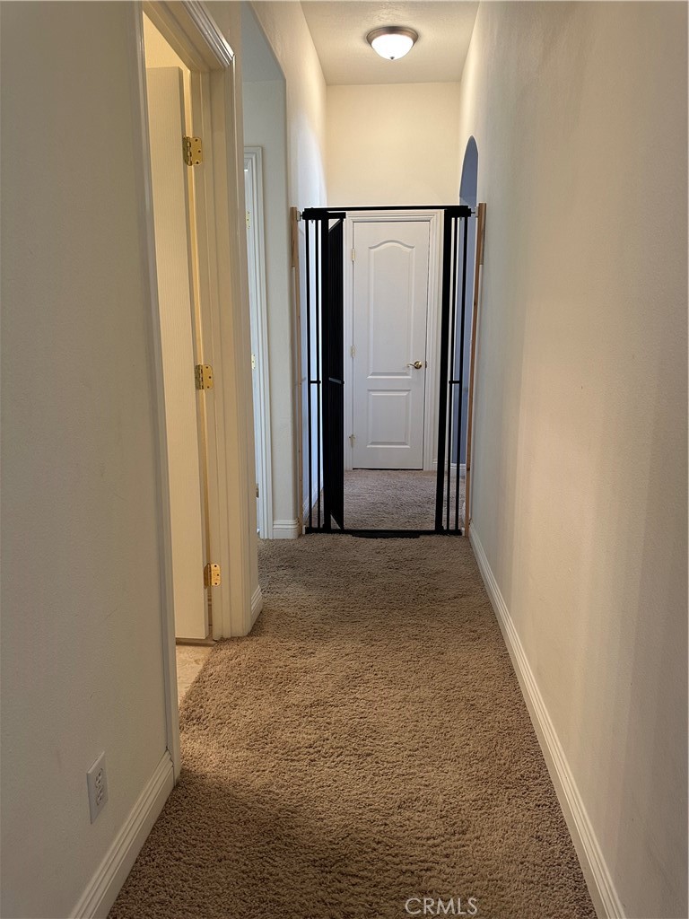 14108 Rivers Edge Road Helendale, CA 92342 - Photo 31 of 37 a view of a hallway with wooden floor