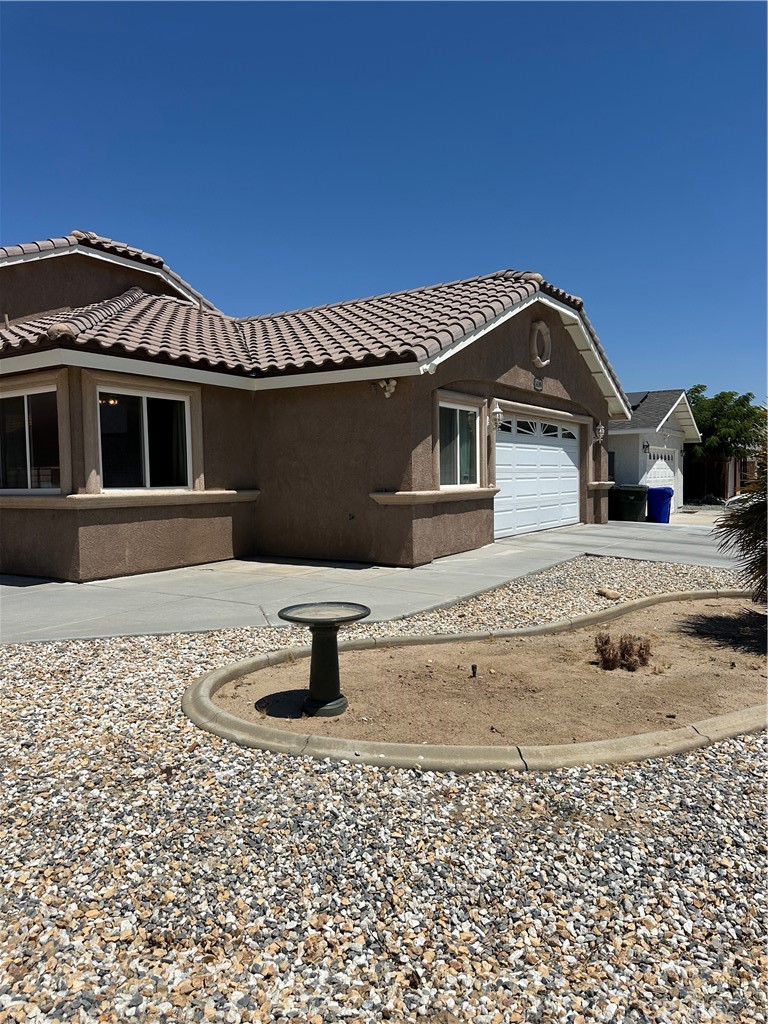 14108 Rivers Edge Road Helendale, CA 92342 - Photo 4 of 37 a front view of a house with a yard