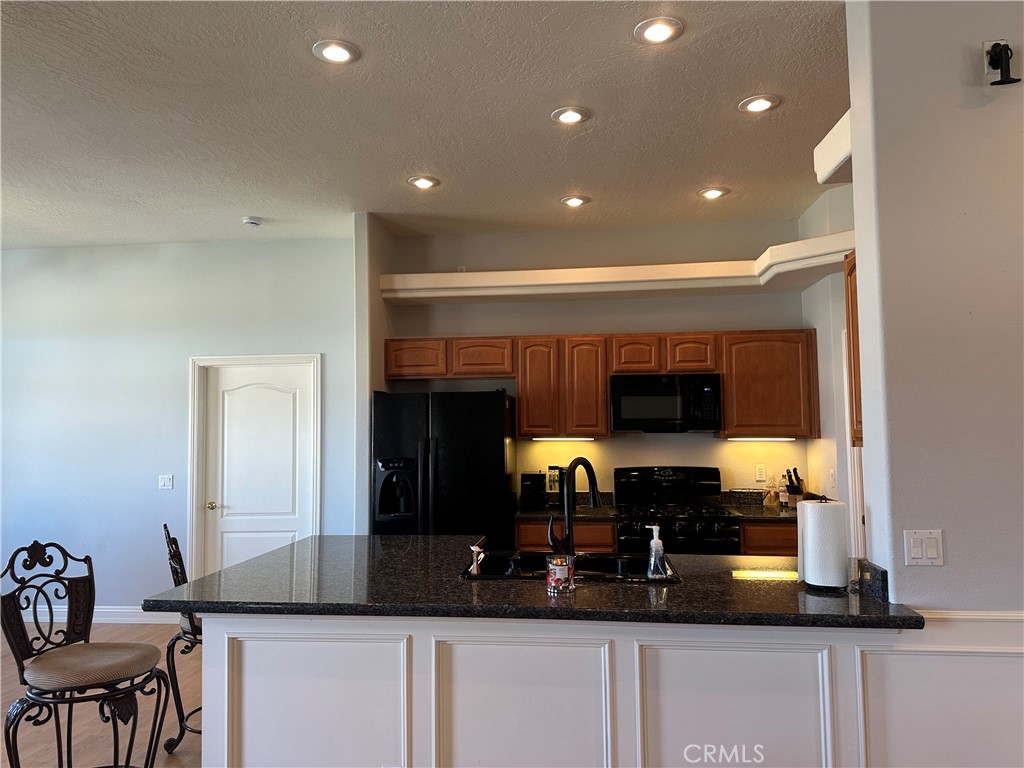 14108 Rivers Edge Road Helendale, CA 92342 - Photo 8 of 37 a kitchen with a sink and a stove top oven