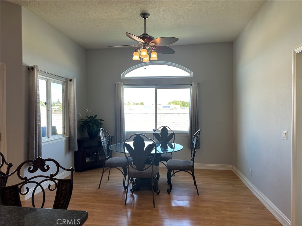 14108 Rivers Edge Road Helendale, CA 92342 - Photo 10 of 37 a dining room with furniture window wooden floor