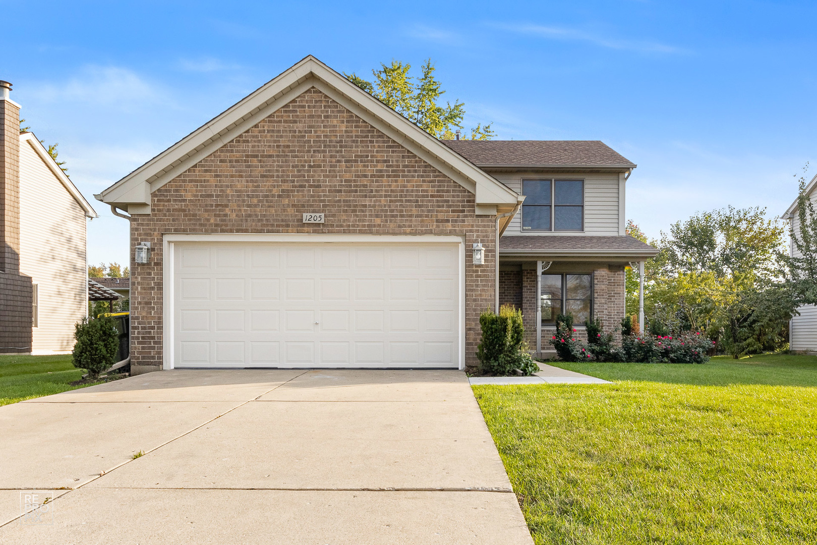 a front view of a house with yard