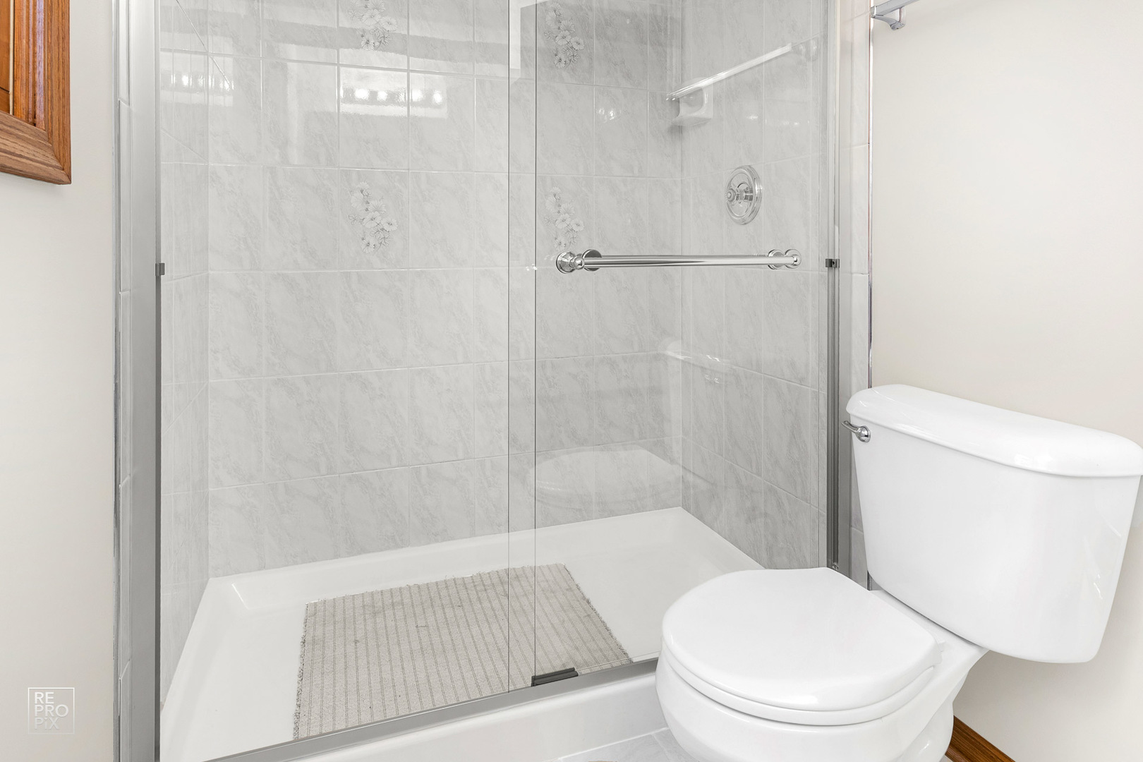 1205 East Camp McDonald Road Prospect Heights, IL 60070 - Photo 13 of 21 a bathroom with a toilet and a shower