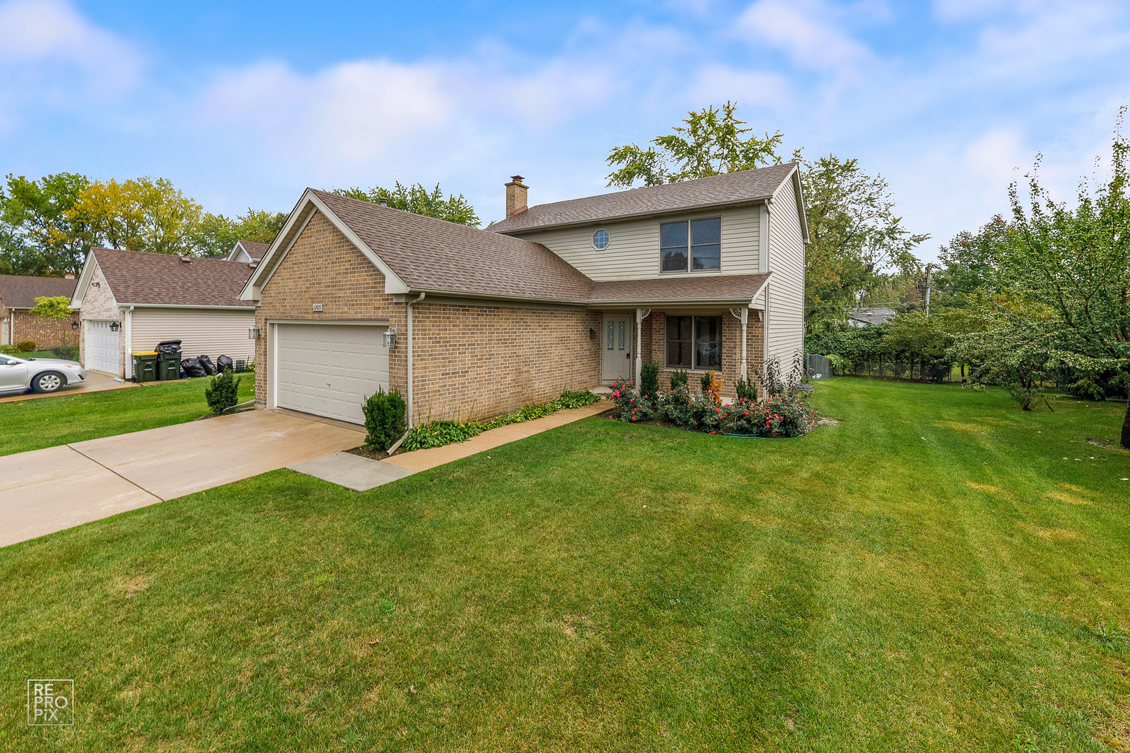 1205 East Camp McDonald Road Prospect Heights, IL 60070 - Photo 2 of 21 a front view of house with yard and green space