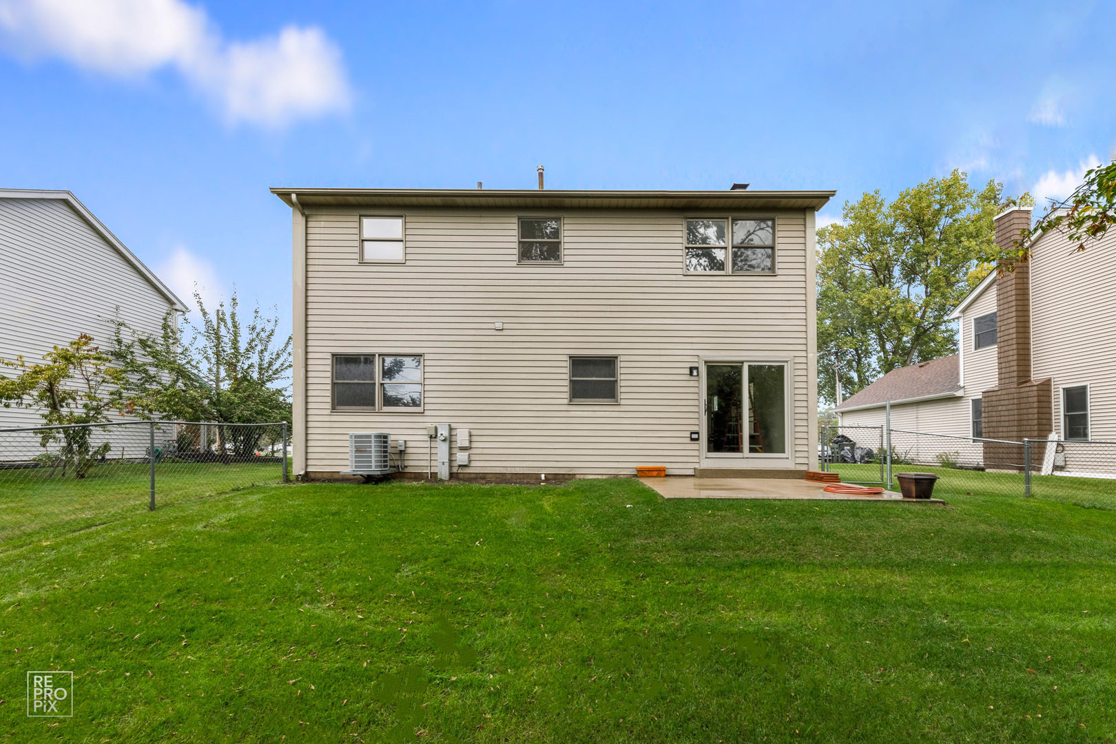 1205 East Camp McDonald Road Prospect Heights, IL 60070 - Photo 21 of 21 a front view of a house with a yard and garage