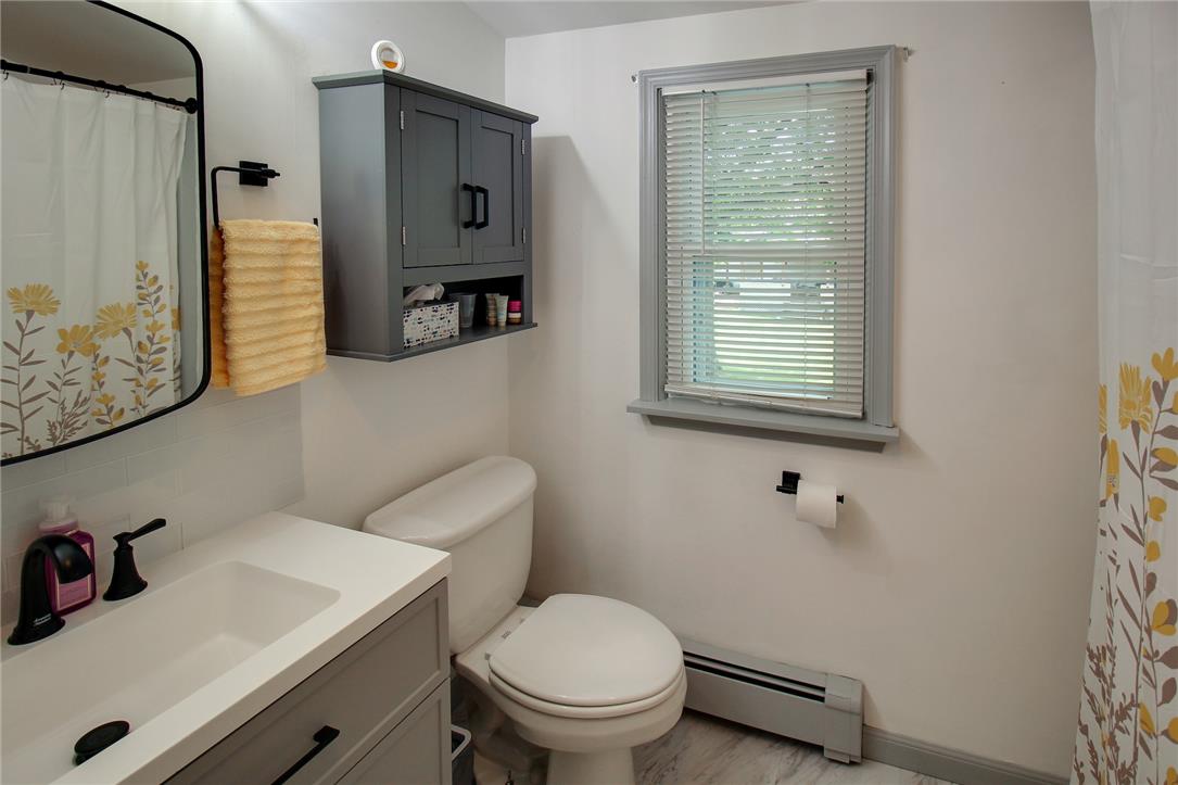 1256 Ridge Avenue Whitehall, PA 18052 - Photo 35 of 43 A compact bathroom offers functionality with a vanity, toilet, and window.