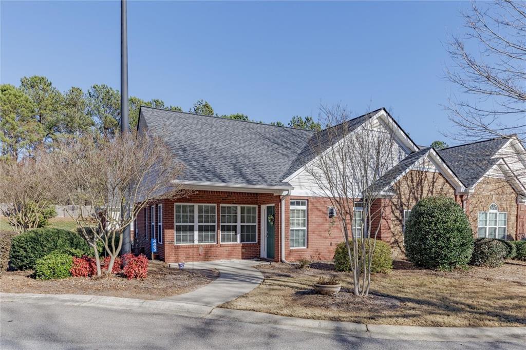 4483 Caleb Crossing Powder Springs, GA 30127 - Photo 1 of 1 a front view of a house with a yard