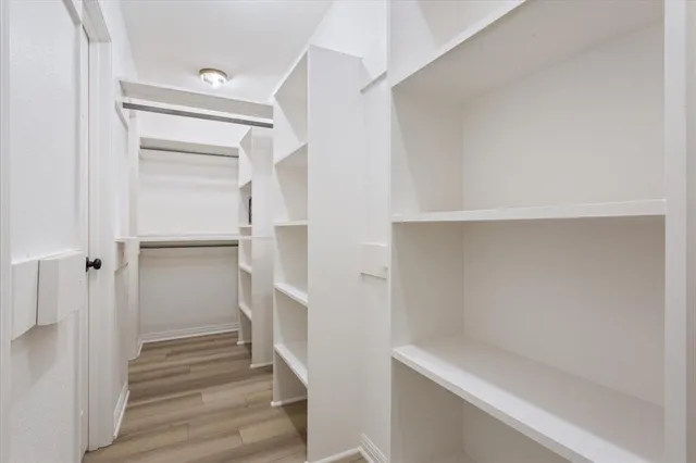 a view of an empty walk in closet