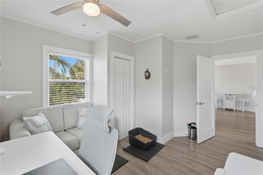 15424 2nd Street East Madeira Beach, FL 33708 - Photo 14 of 30 a living room with furniture and a window