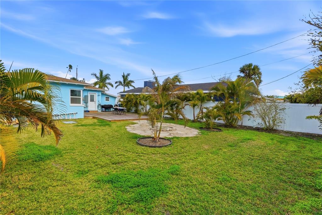 15424 2nd Street East Madeira Beach, FL 33708 - Photo 22 of 30 a view of a swimming pool with a yard