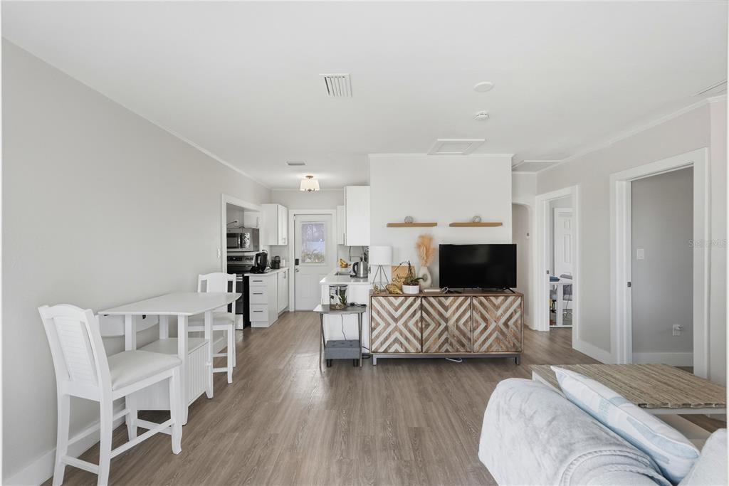 15424 2nd Street East Madeira Beach, FL 33708 - Photo 3 of 30 a living room with furniture and a wooden floor