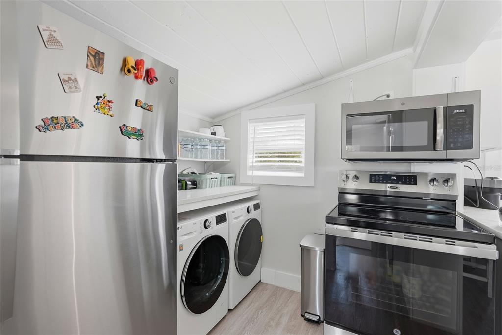15424 2nd Street East Madeira Beach, FL 33708 - Photo 9 of 30 a view of kitchen with washer and dryer