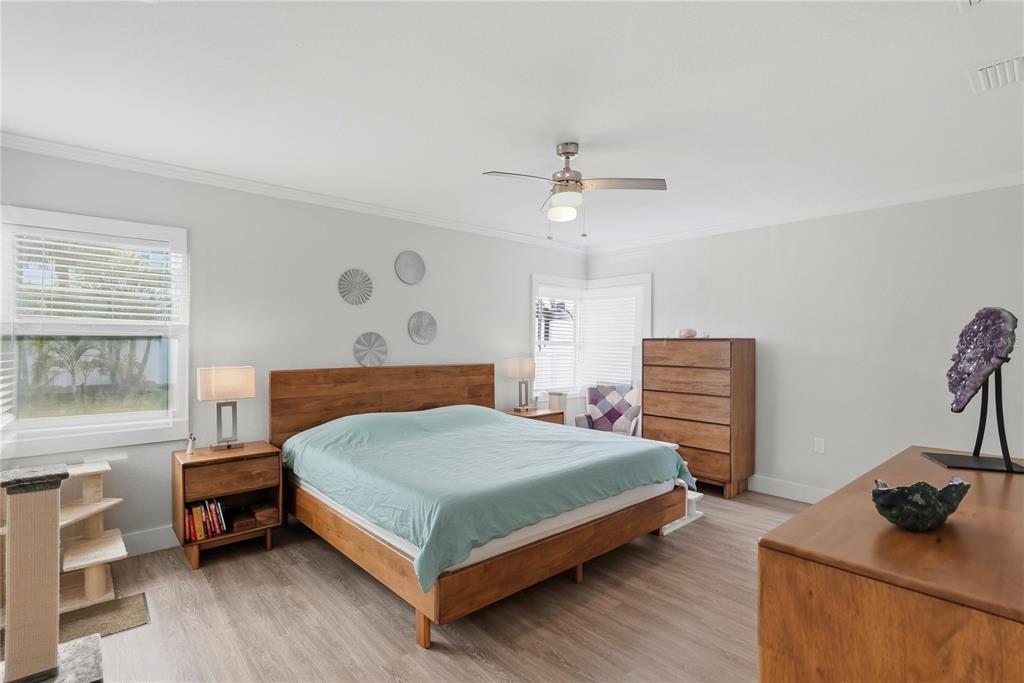 15424 2nd Street East Madeira Beach, FL 33708 - Photo 10 of 30 a bedroom with a bed and a dresser