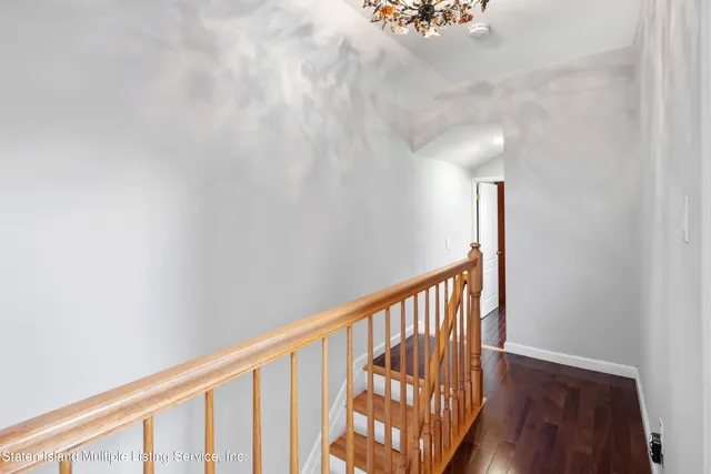 a view of staircase with rug