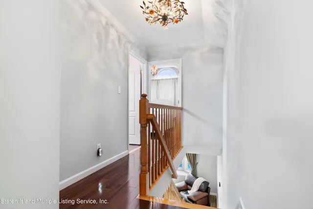 a view of a hallway with staircase