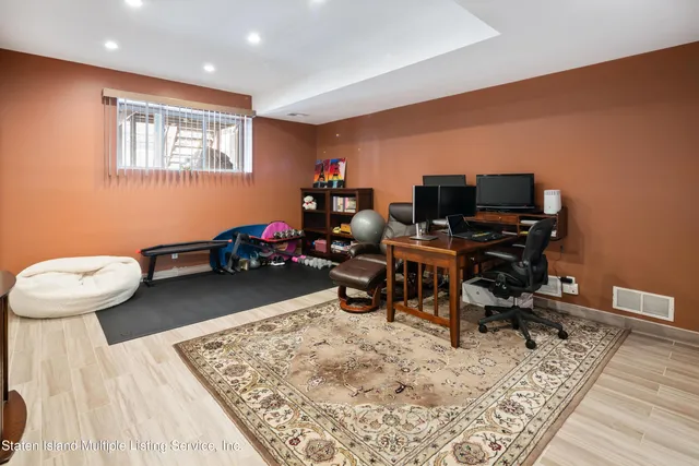 a room with furniture and a wooden floor