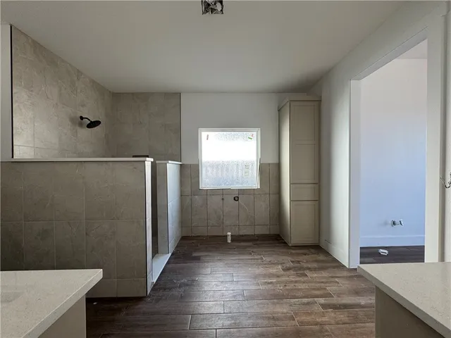 a view of a bathroom with a sink and a mirror