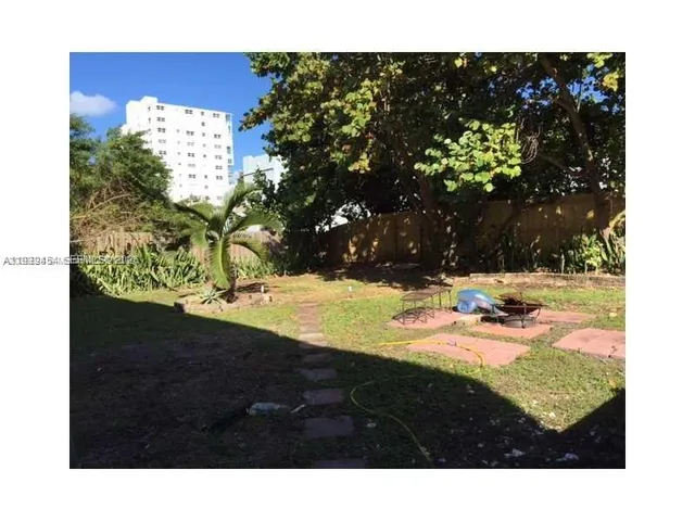 a view of swimming pool from a yard