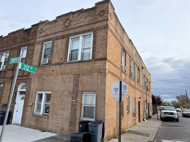 a front view of a building with parking
