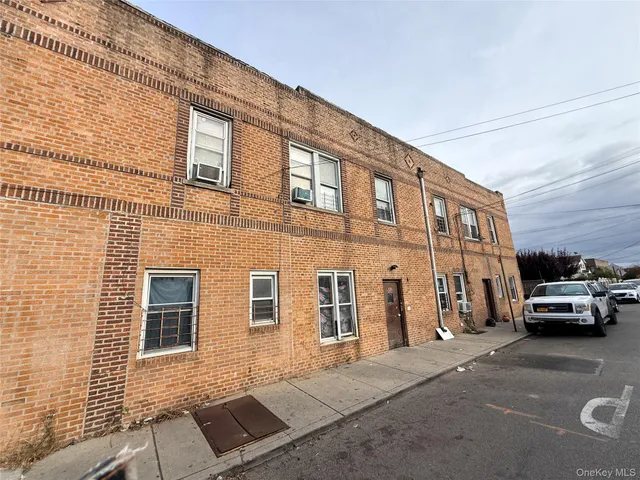 a view of a car park in front of a building