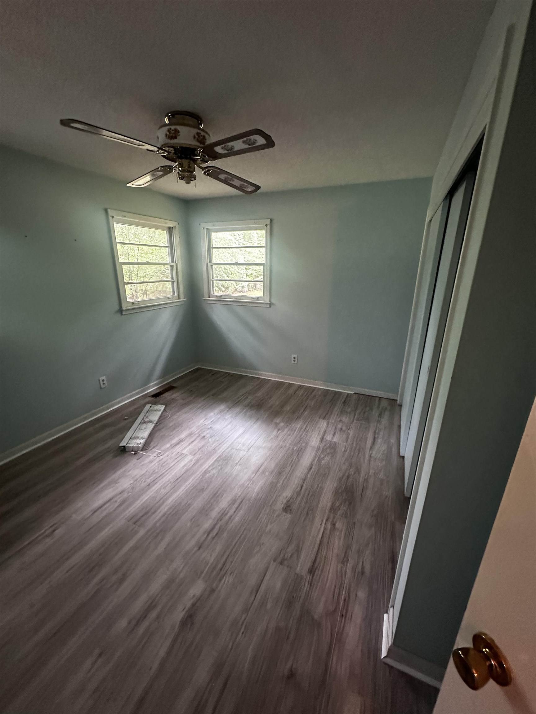 1865 Bartlett Road Memphis, TN 38134 - Photo 18 of 26 a view of an empty room with wooden floor and a window