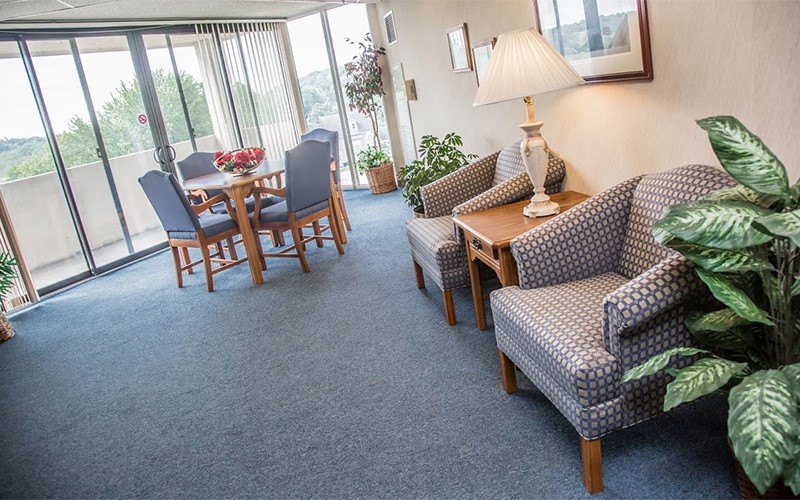404 St Louis Avenue Excelsior Springs, MO 64024 - Photo 7 of 12 a living room with furniture and a large window