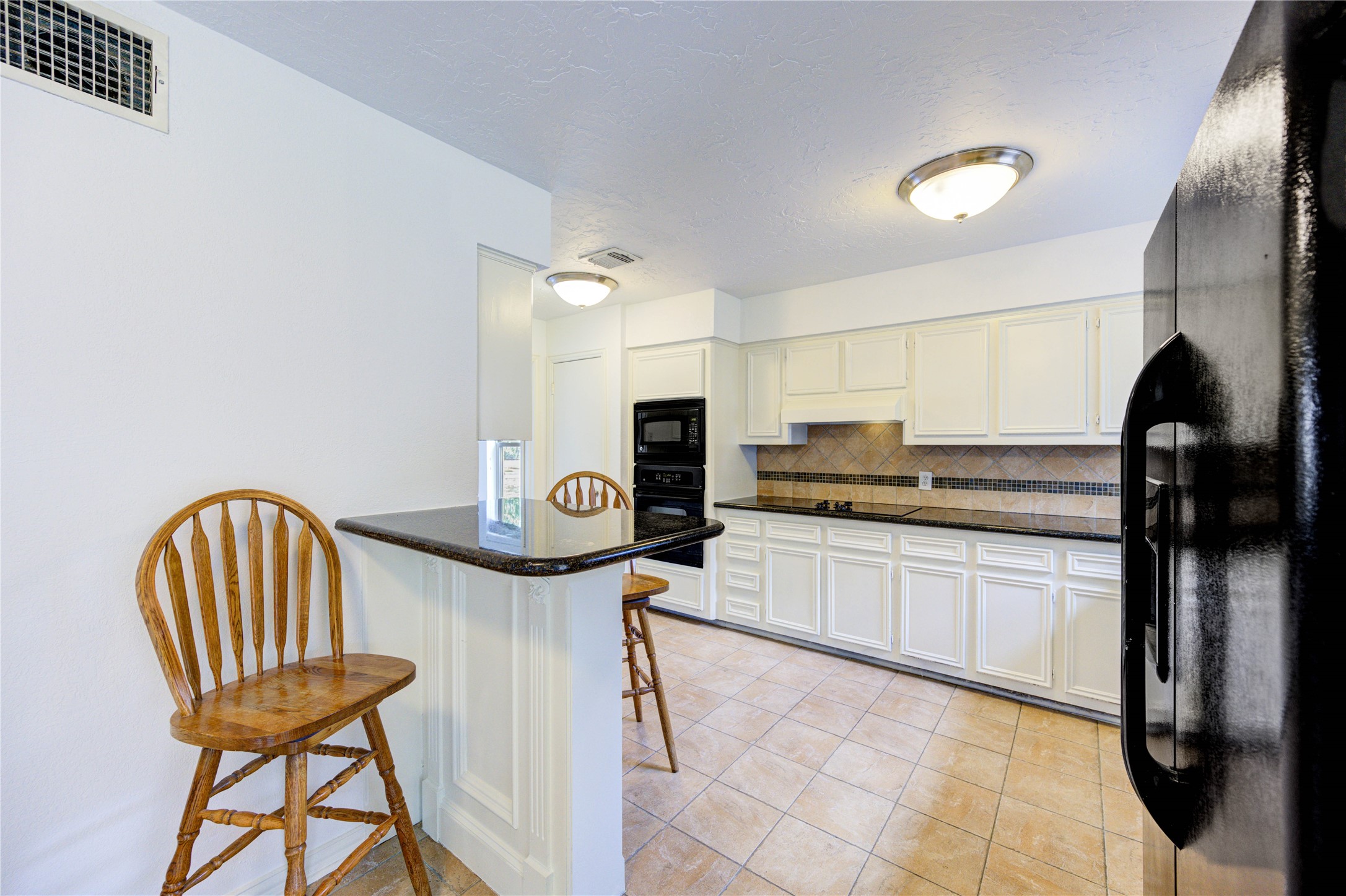 3639 Fir Forest Drive Spring, TX 77388 - Photo 22 of 44 a kitchen with stainless steel appliances granite countertop a sink and cabinets