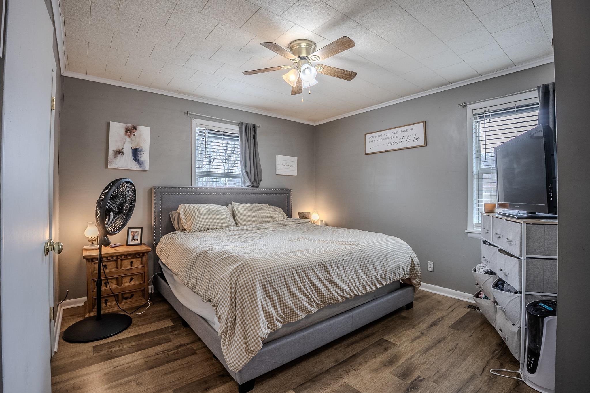 6620 Conner Whitefield Road Ripley, TN 38063 - Photo 11 of 13 a bedroom with a bed and a chandelier