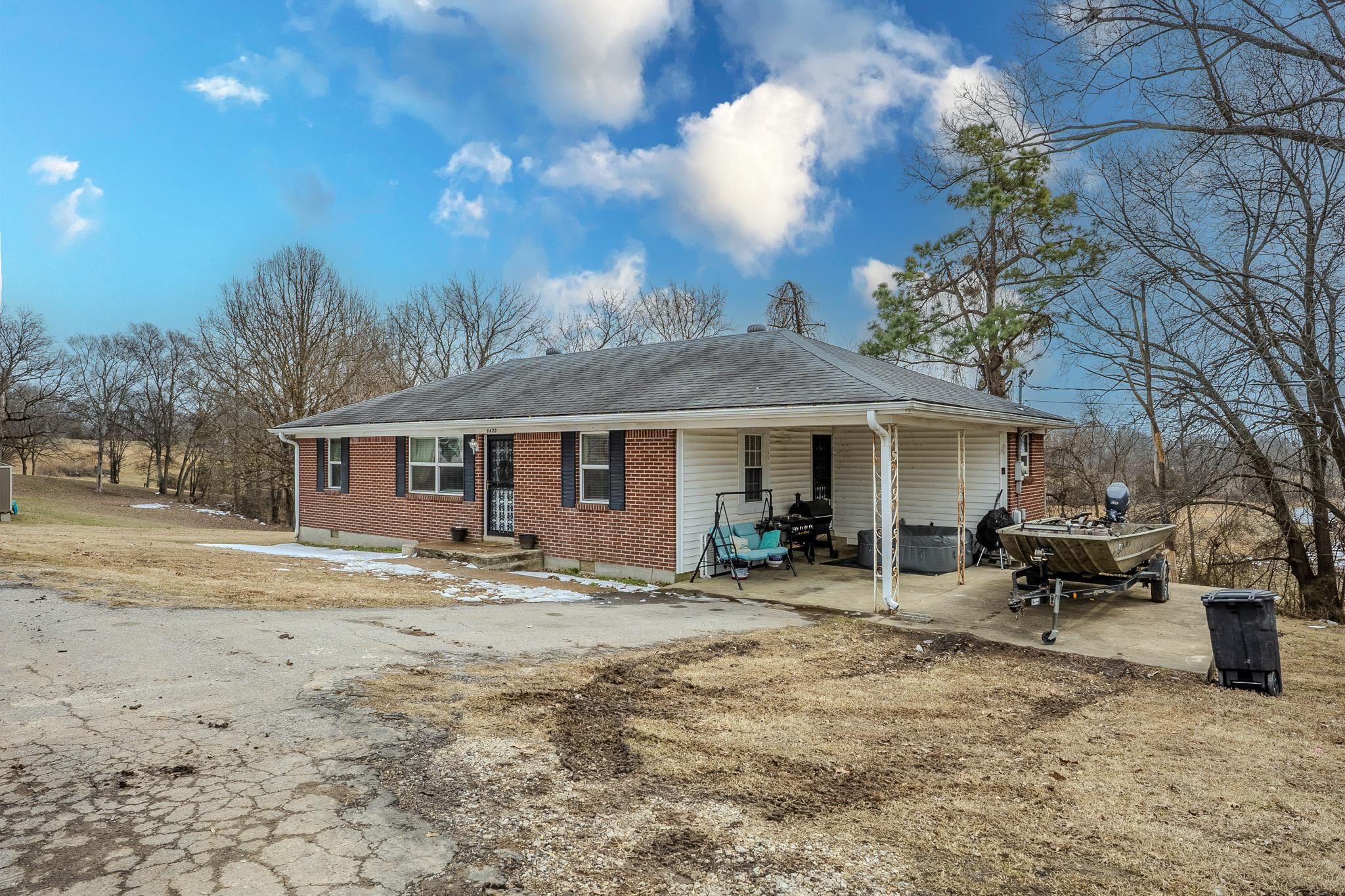 6620 Conner Whitefield Road Ripley, TN 38063 - Photo 2 of 13 a front view of a house with a yard and trees