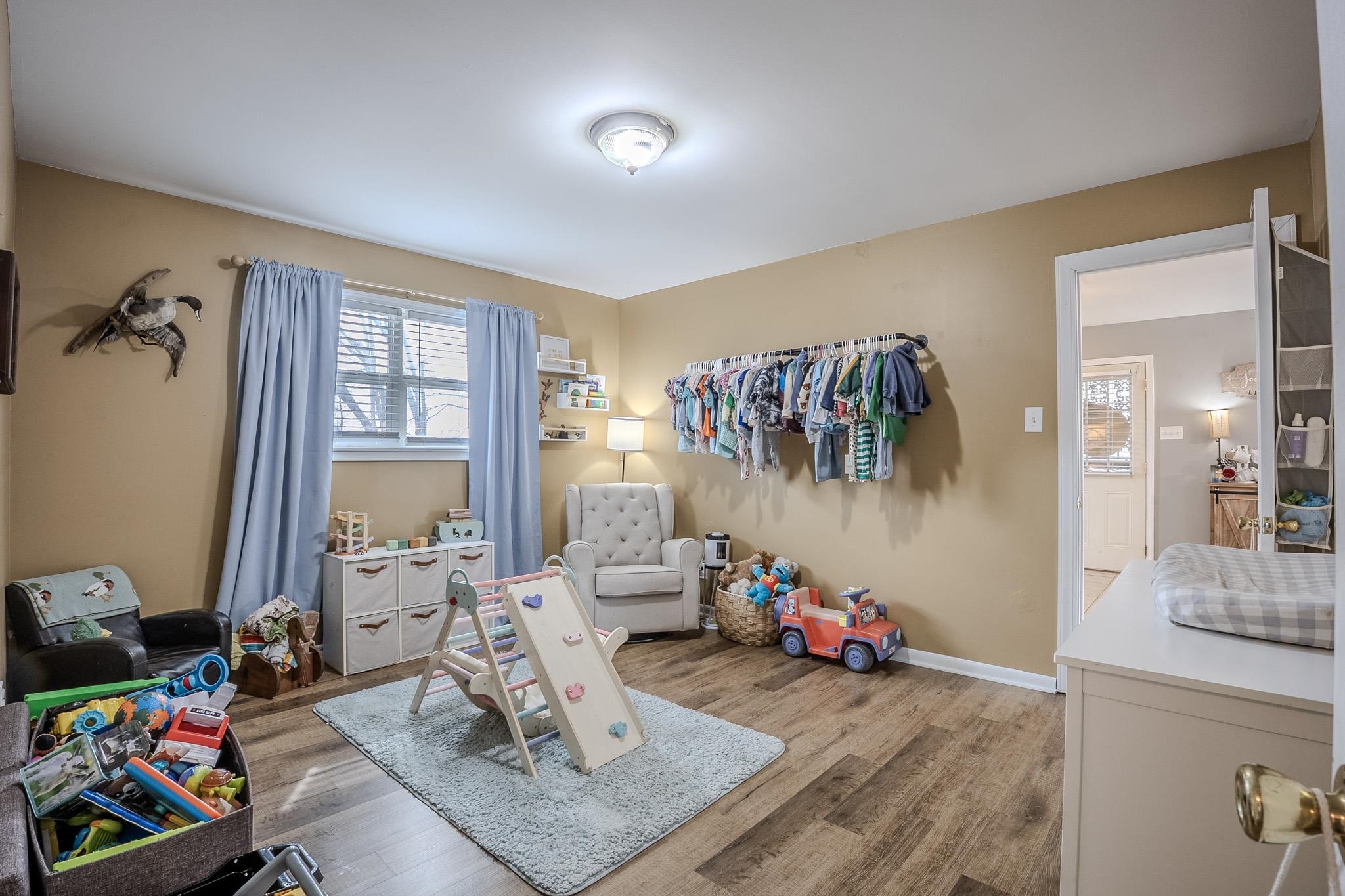 6620 Conner Whitefield Road Ripley, TN 38063 - Photo 9 of 13 a living room with furniture and a wooden floor