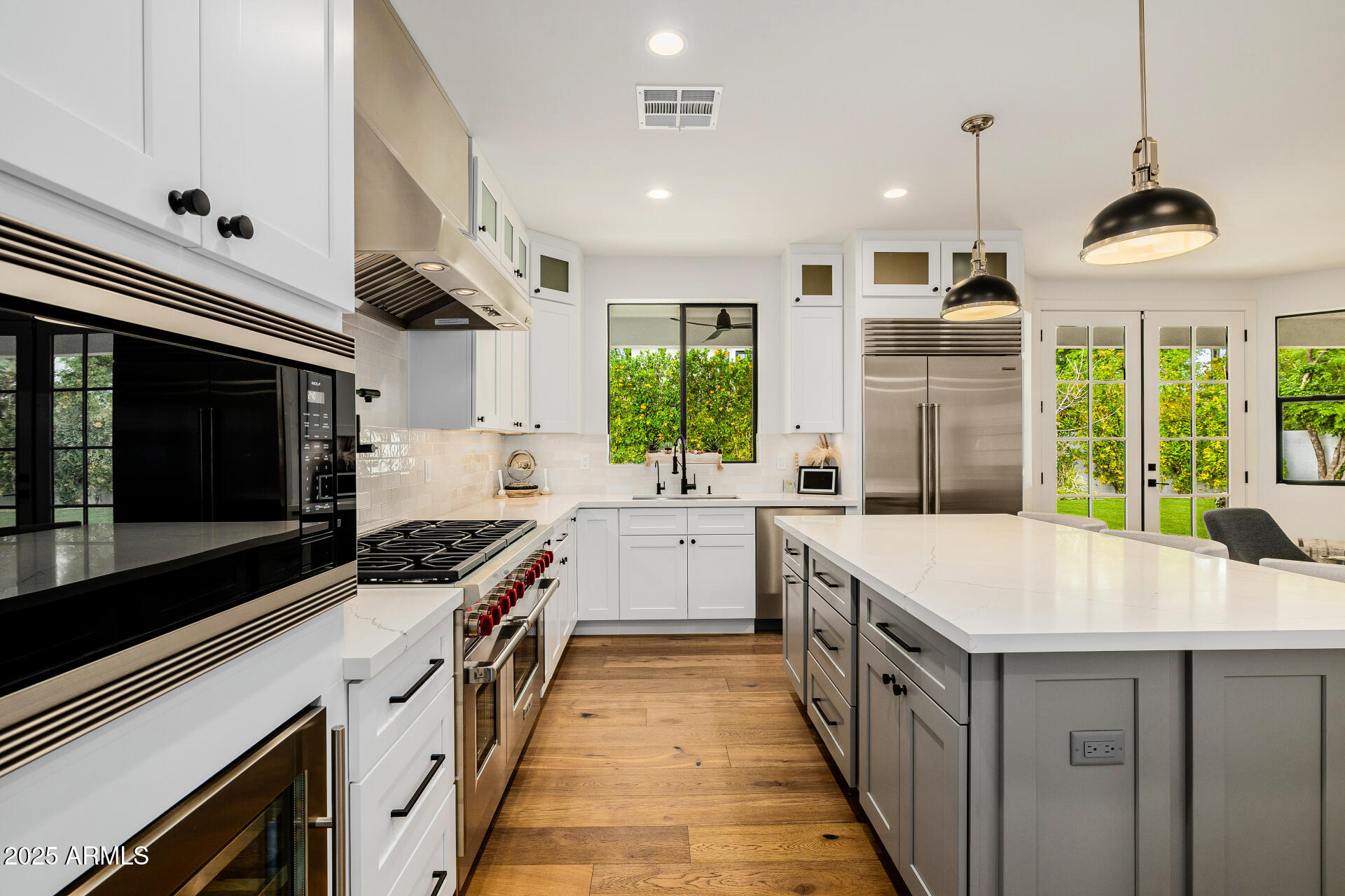 7245 North 13th Lane Phoenix, AZ 85021 - Photo 11 of 40 a kitchen with stainless steel appliances a sink and a stove