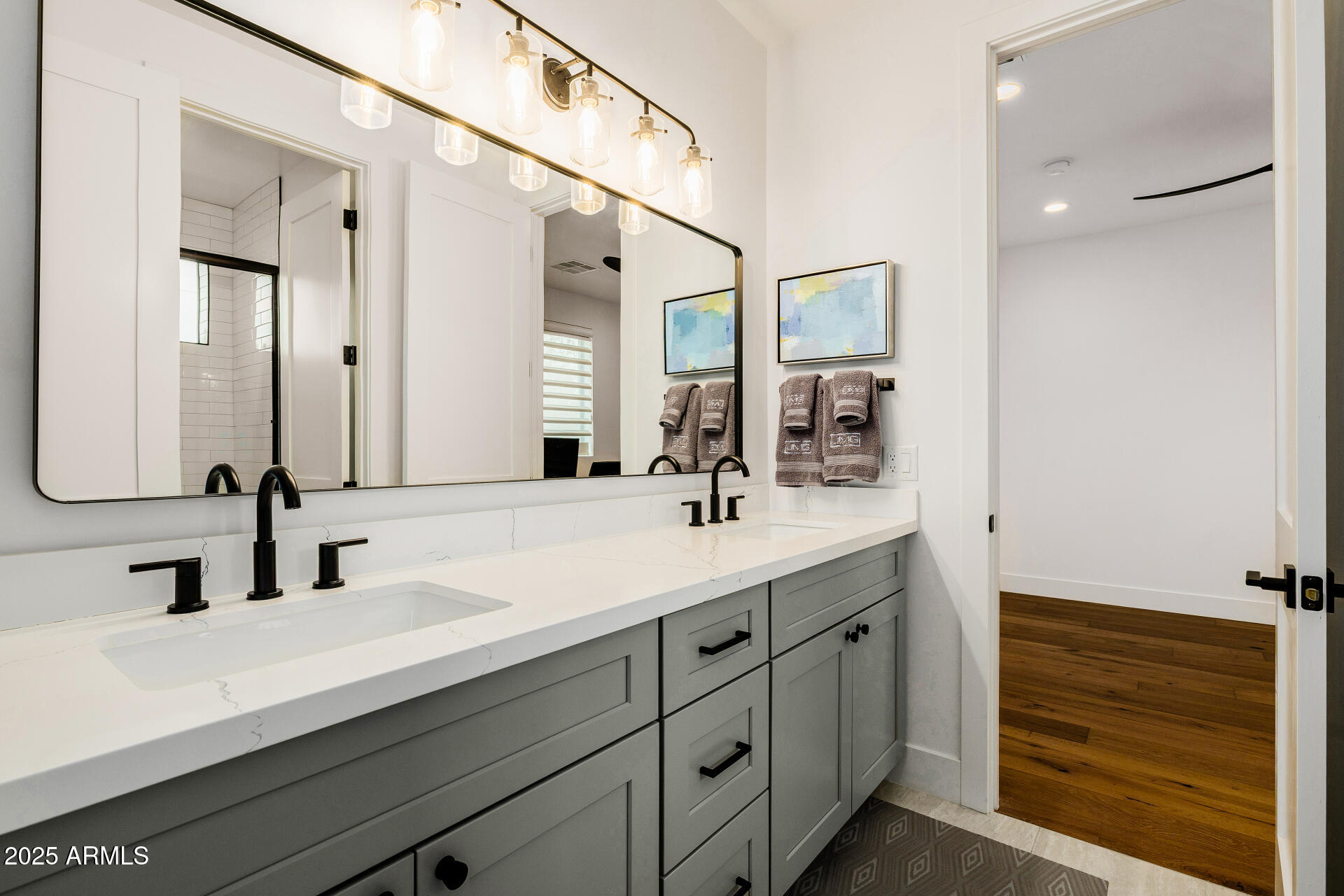 7245 North 13th Lane Phoenix, AZ 85021 - Photo 20 of 40 a bathroom with a double vanity sink and a mirror
