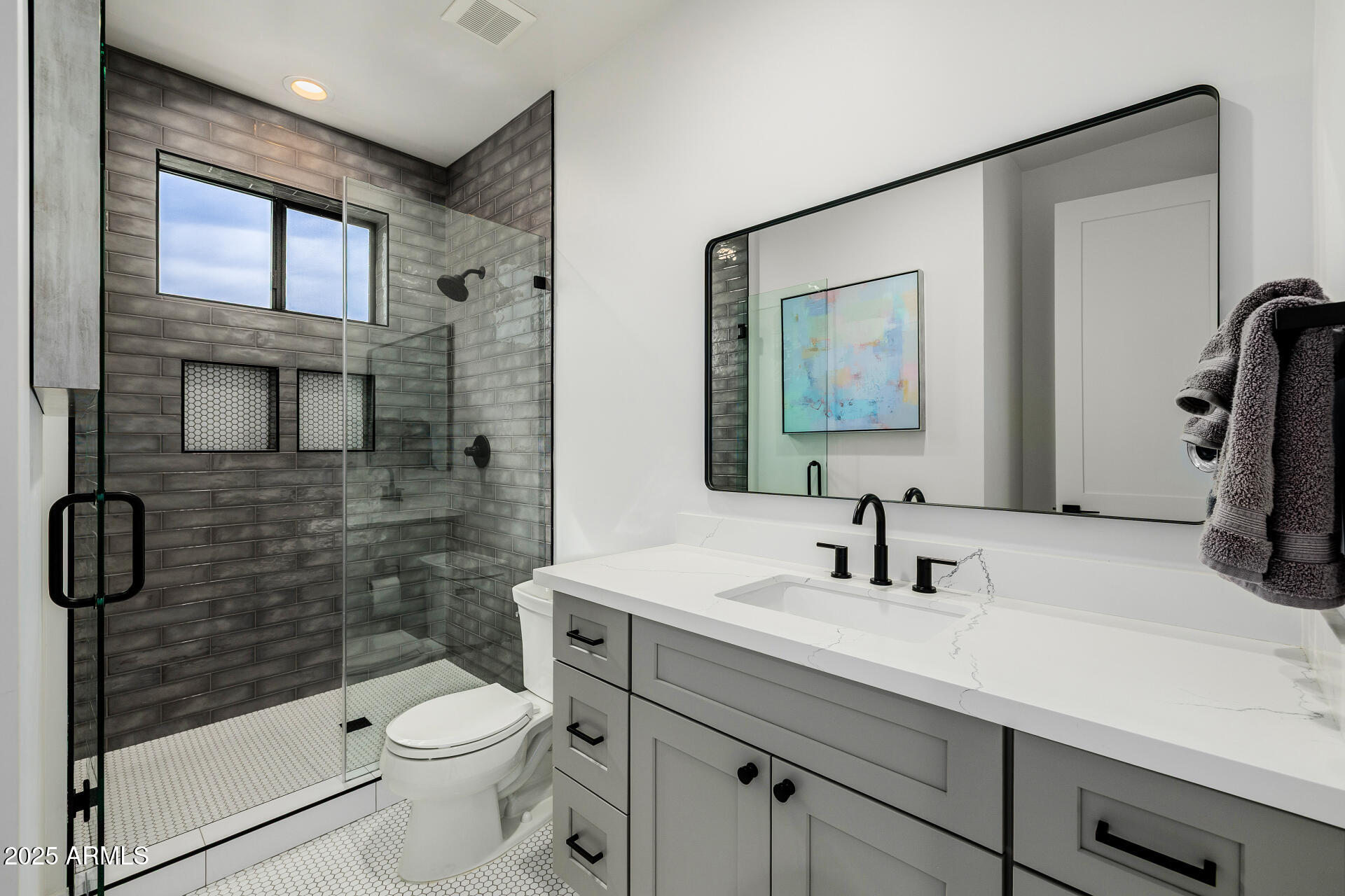 7245 North 13th Lane Phoenix, AZ 85021 - Photo 22 of 40 a bathroom with a sink a toilet and shower