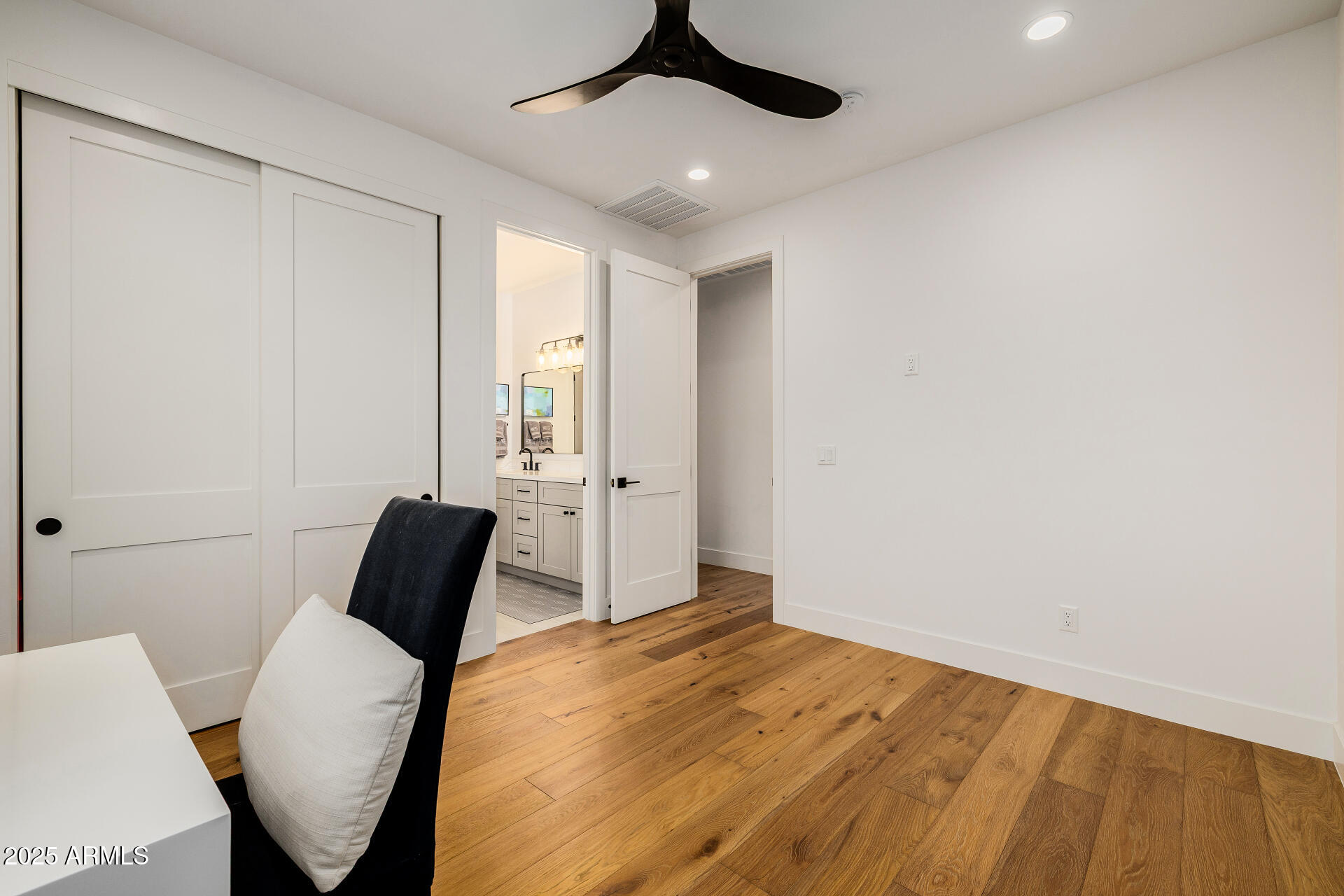 7245 North 13th Lane Phoenix, AZ 85021 - Photo 24 of 40 a bedroom with a bed and a chair