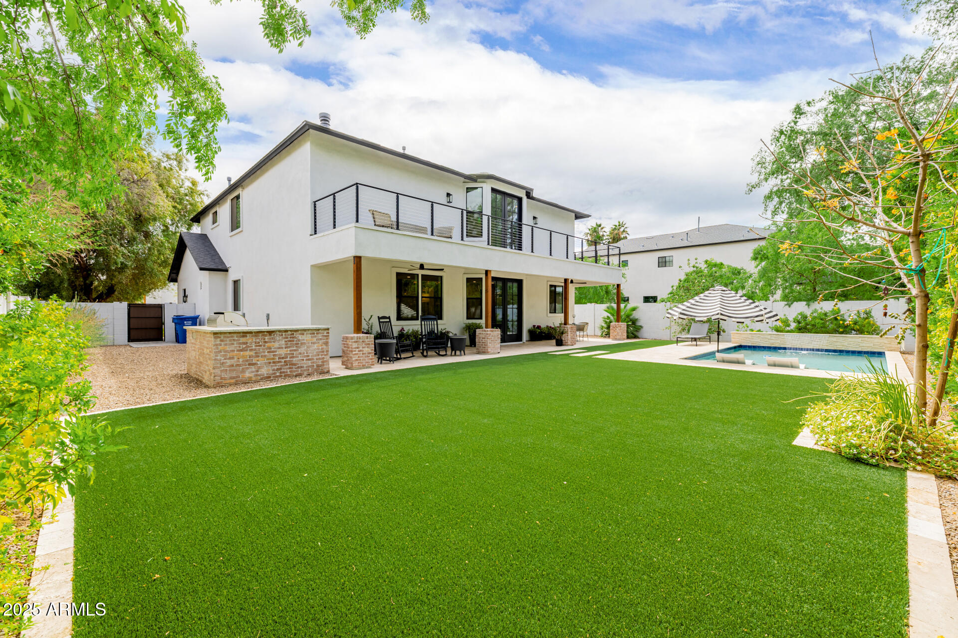 7245 North 13th Lane Phoenix, AZ 85021 - Photo 26 of 40 a view of house with a big yard and potted plants