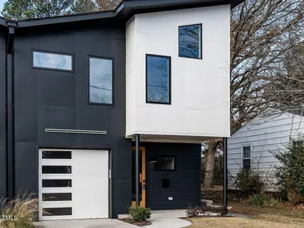 a front view of a house with parking