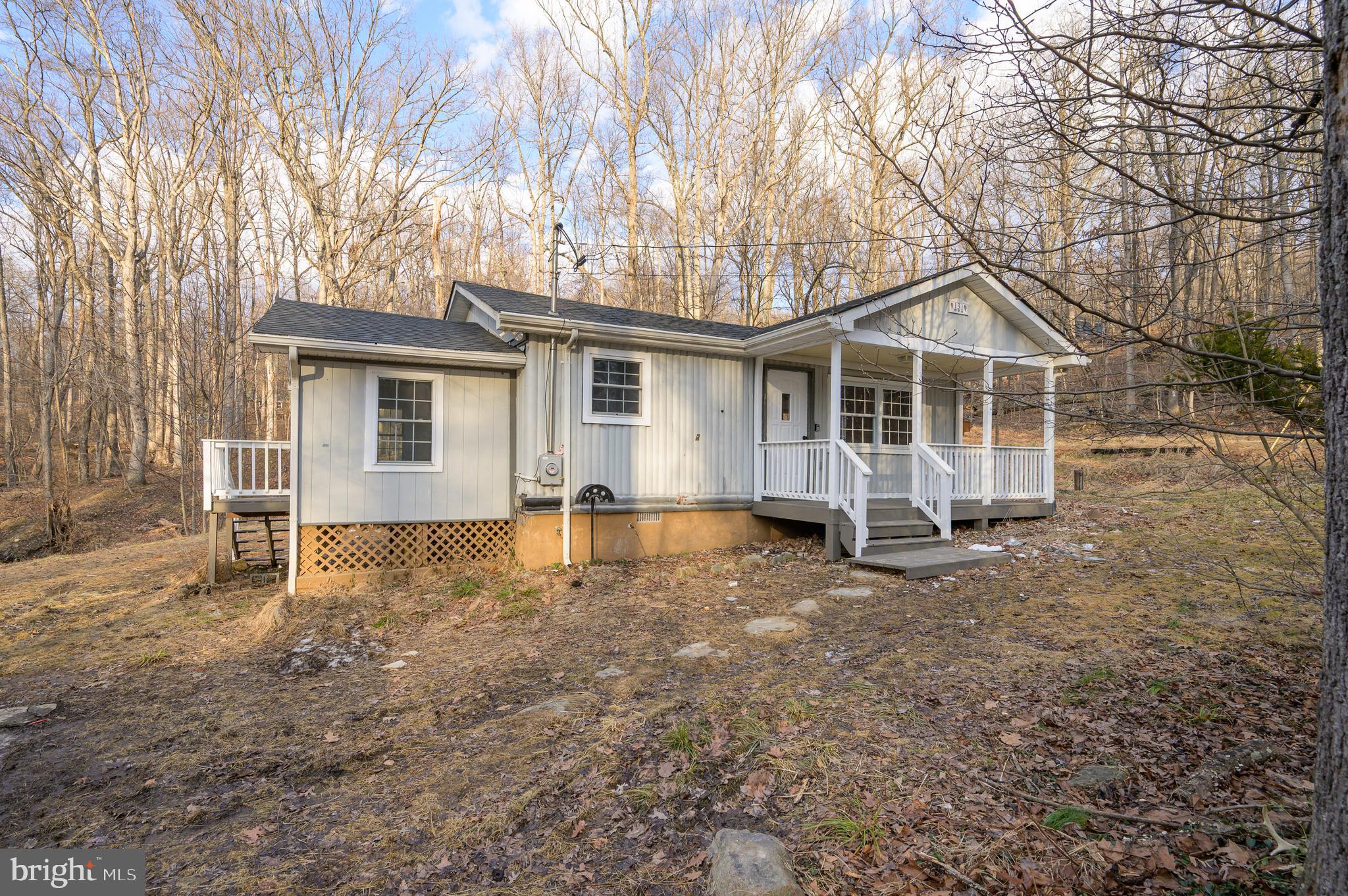 131 Flop Ear Road Harpers Ferry, WV 25425 - Photo 21 of 24 a view of a house with a yard