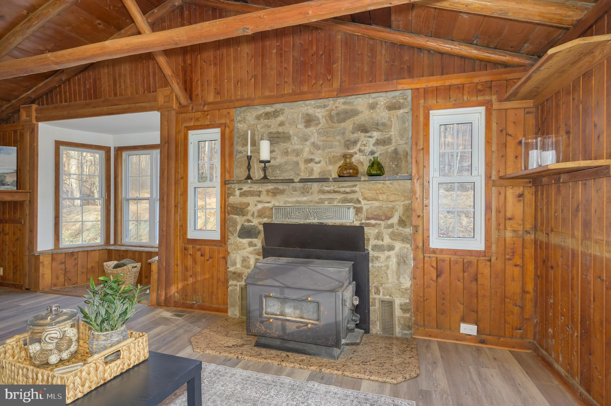 131 Flop Ear Road Harpers Ferry, WV 25425 - Photo 23 of 24 a living room with a fireplace windows and a wooden floor