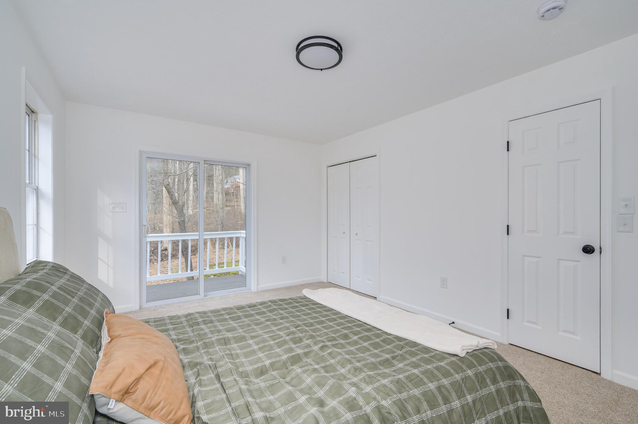 131 Flop Ear Road Harpers Ferry, WV 25425 - Photo 3 of 24 a bedroom with a bed and a window