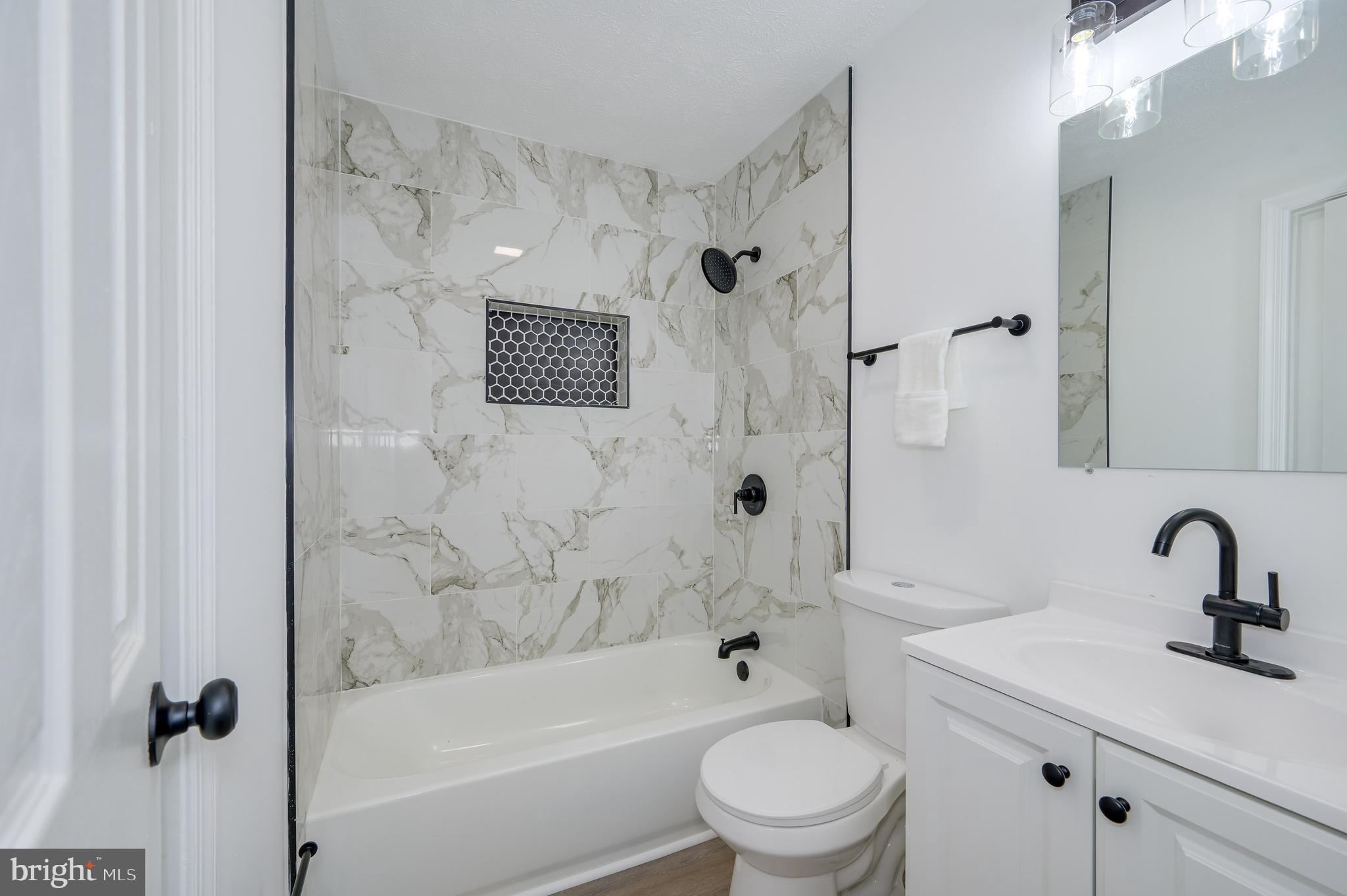 131 Flop Ear Road Harpers Ferry, WV 25425 - Photo 6 of 24 a bathroom with a sink toilet and shower