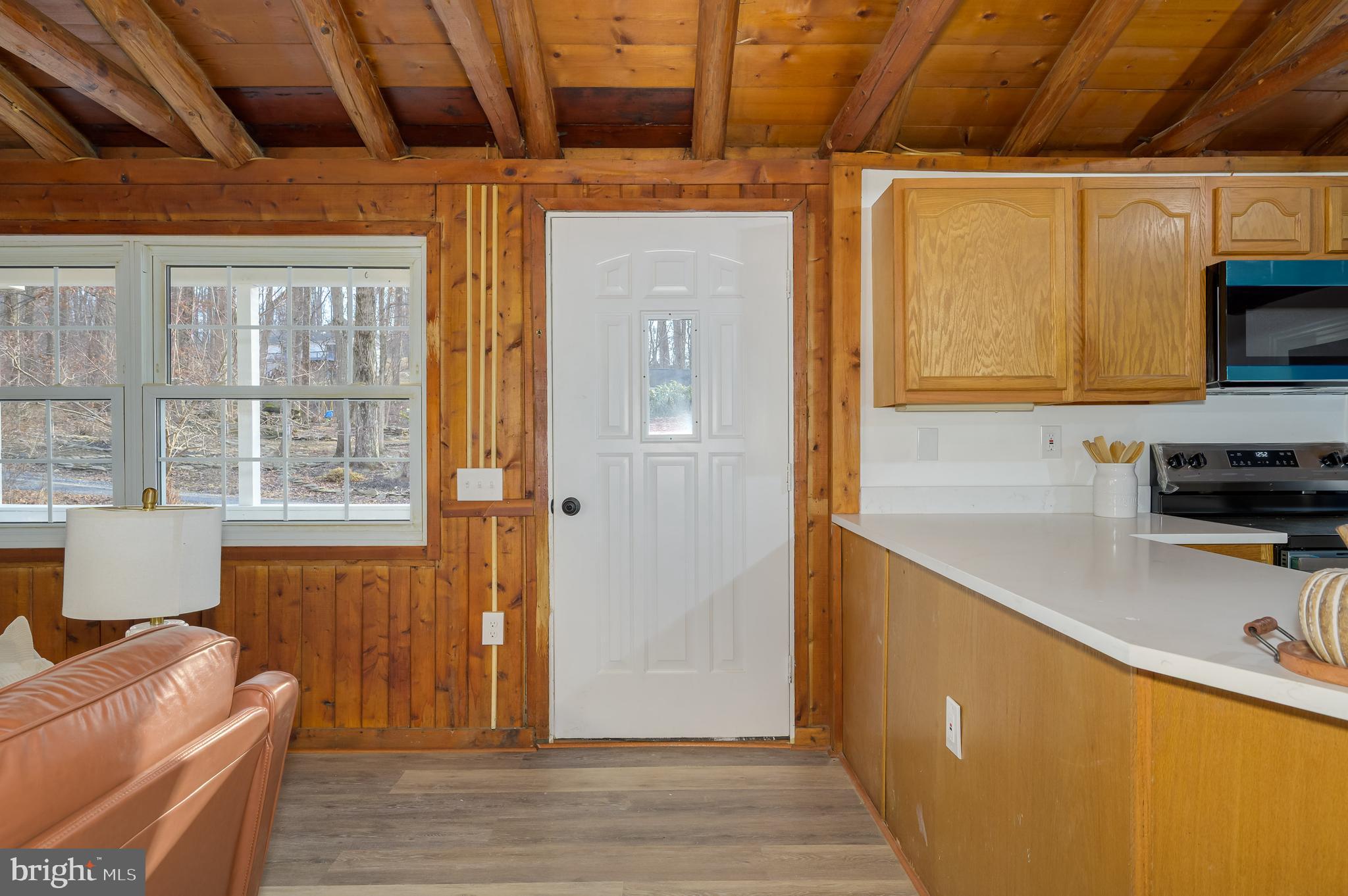 131 Flop Ear Road Harpers Ferry, WV 25425 - Photo 10 of 24 a kitchen with stainless steel appliances granite countertop a stove a refrigerator a sink and dishwasher with wooden floor
